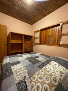 Ein Bett oder Betten in einem Zimmer der Unterkunft Pousada Sonho Meu