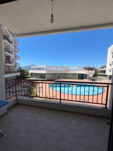 a balcony with a view of a swimming pool at Orikum RelaxHouse in Orikum