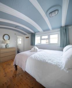 Ένα ή περισσότερα κρεβάτια σε δωμάτιο στο Windy Ridge