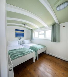 Ένα ή περισσότερα κρεβάτια σε δωμάτιο στο Windy Ridge