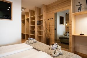 Ένα ή περισσότερα κρεβάτια σε δωμάτιο στο Hotel Dahu