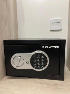 a microwave with the words it father written on it at Hotel República Junior Suite in Villa María