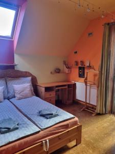 Postel nebo postele na pokoji v ubytování Bámbi Apartman