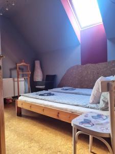 Postel nebo postele na pokoji v ubytování Bámbi Apartman