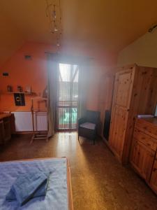 Postel nebo postele na pokoji v ubytování Bámbi Apartman
