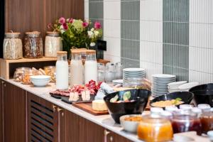 a buffet line with food and other food items on it at Mercure Maintenon in Maintenon