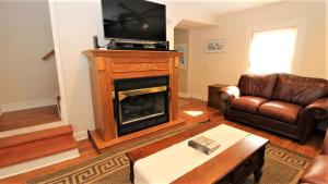 a living room with a fireplace and a couch at 111 Leaming Ave in West Cape May