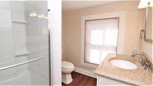 a bathroom with a sink and a toilet at 111 Leaming Ave in West Cape May +21 photos