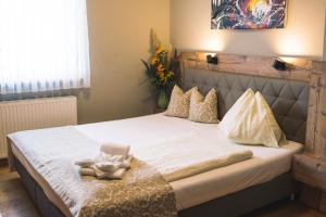 Łóżko lub łóżka w pokoju w obiekcie Hotel Restaurant Thadeushof