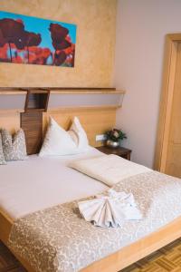 Łóżko lub łóżka w pokoju w obiekcie Hotel Restaurant Thadeushof