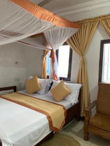 Кровать или кровати в номере Usangi House