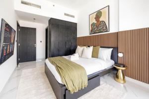 Voodi või voodid majutusasutuse New 1BR with Full Balcony Gym Pool and Sauna toas