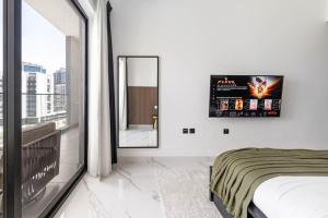 Voodi või voodid majutusasutuse New 1BR with Full Balcony Gym Pool and Sauna toas