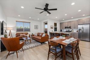 a kitchen and living room with a table and chairs at New- Pool, Hot Tub, Nintendo Switch, Pool, Pickleball and Ping Pong Fun in Santa Clara