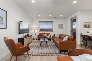 a living room with a couch and a table at New- Pool, Hot Tub, Nintendo Switch, Pool, Pickleball and Ping Pong Fun in Santa Clara