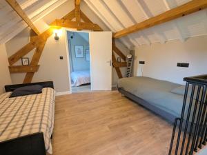 En eller flere senge i et værelse på Le Clos d Emilie