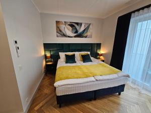 Postel nebo postele na pokoji v ubytování FortuCity Apartment + 2 fotografie