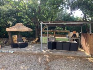 a pavilion with a table and an umbrella at U FARNIENTE in Patrimonio