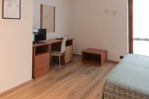 Postel nebo postele na pokoji v ubytování Albergo Ristorante Orazio