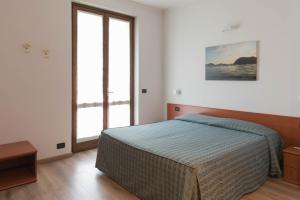 Postel nebo postele na pokoji v ubytování Albergo Ristorante Orazio
