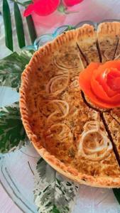 a pie sitting on a glass plate on a table at Chez Max Pousada in Morro de São Paulo