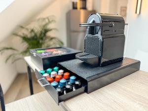 a table with a hot dog stand with a drink cooler at ImmoStay- Neustadt Apartments, TV & WiFi in Bremen