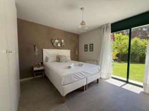 Postel nebo postele na pokoji v ubytování TarracoHomes, Town House La Mora + 37 fotografií