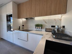 Kuchyň nebo kuchyňský kout v ubytování TarracoHomes, Town House La Mora