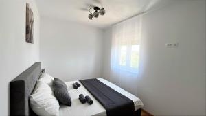 Postel nebo postele na pokoji v ubytování Apartman Luce