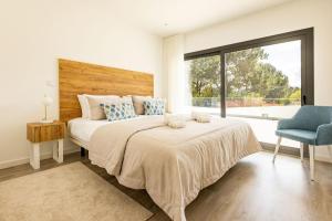 Postel nebo postele na pokoji v ubytování Sunset Beach Apartment - BY SCH + 25 fotografií