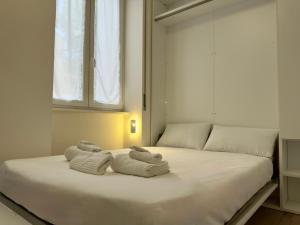 Postel nebo postele na pokoji v ubytování Navigli Modern Stay