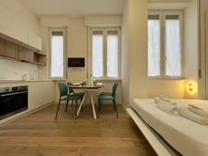 Postel nebo postele na pokoji v ubytování Navigli Modern Stay