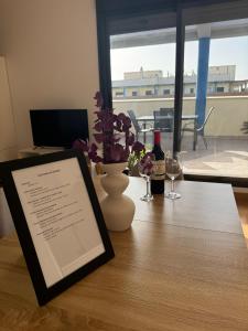 TV a/nebo společenská místnost v ubytování Apartamento y ático en Tomares, Sevilla