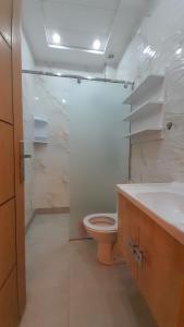 a bathroom with a toilet and a shower and a sink at Azur et Atlas in Saïdia +13 photos