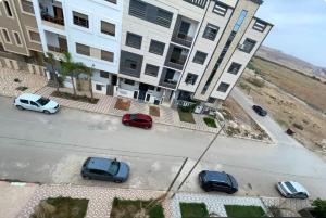 an aerial view of cars parked in front of a building at Azur et Atlas in Saïdia