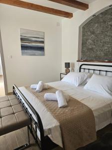 a bedroom with two beds with towels on them at Apartment Lotta in Sali