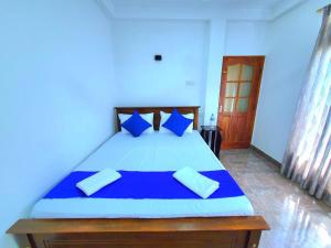 Postel nebo postele na pokoji v ubytování Anu Homestay