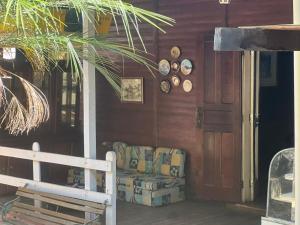 a living room with a couch in a house at hostel brasil in Águas da Prata +8 photos
