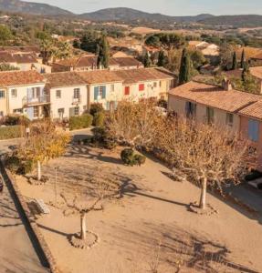 an aerial view of a town with trees and buildings at Maison Jobèr in Plan-de-la-Tour