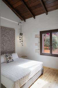 Postel nebo postele na pokoji v ubytování Venetian Palace Chania