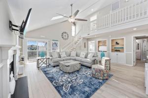 a living room with a couch and a table at Channel Surfer in Myrtle Beach