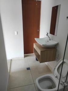 a bathroom with a sink and a toilet at Recanto dos Amigos in Itapetininga +31 photos
