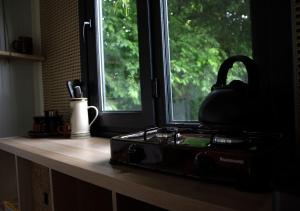 a kitchen counter with a stove and a window at Home under the moon in Boňkov +17 photos