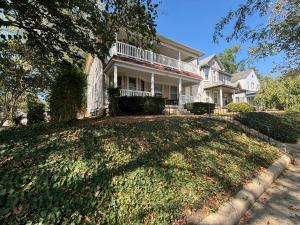 a large white house with a large yard at 2BR 1st floor suite close to ISU in Terre Haute