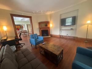 a living room with a couch and a table at 2BR 1st floor suite close to ISU in Terre Haute