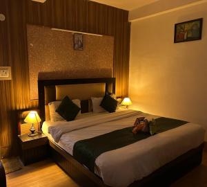 Postel nebo postele na pokoji v ubytování Hotel Redchilli