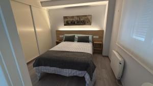 Postel nebo postele na pokoji v ubytování Avenida de Arteixo. Precioso apartamento