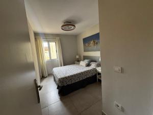 A bed or beds in a room at Luminoso apart Mareverde