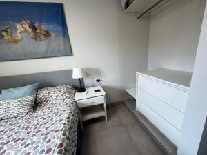 A bed or beds in a room at Luminoso apart Mareverde