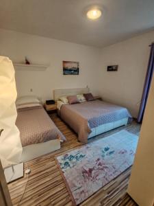 Posteľ alebo postele v izbe v ubytovaní Apartment Oscar